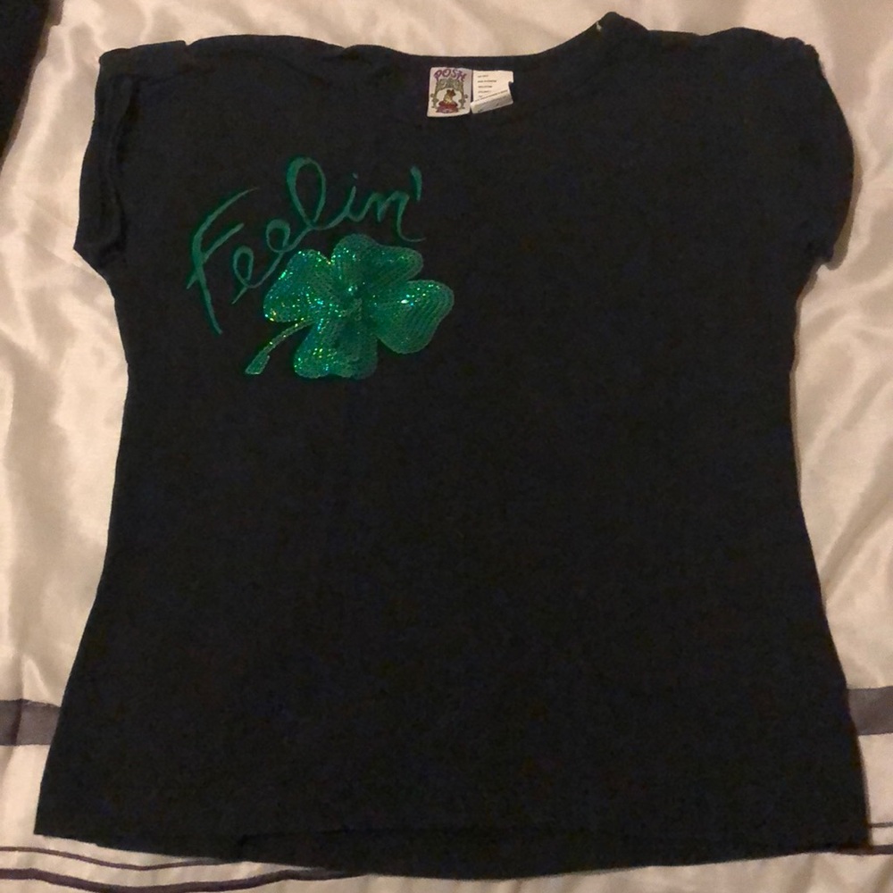 Black tee shirt with green sequins.